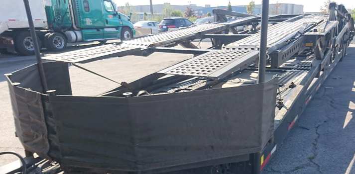 Tarps used on car carriers to prevent stone chips Tarps used on car carriers to prevent stone chips