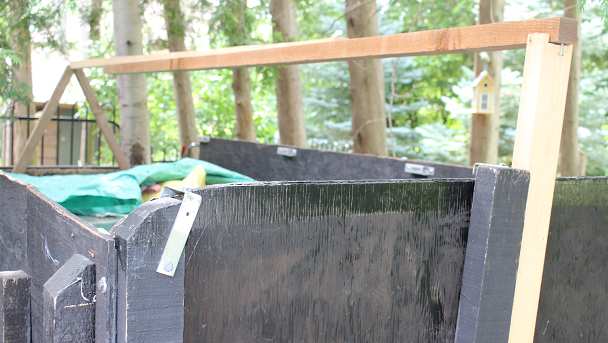 Board used to raise the center of the tarp so that it sheds water Board used to raise the center of the tarp so that it sheds water