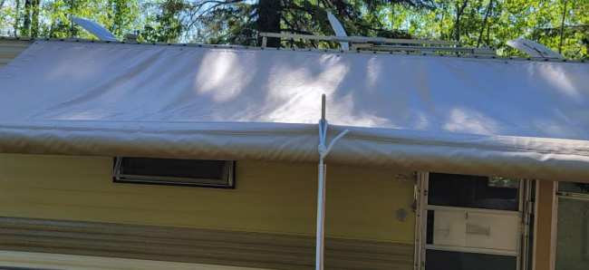 Trailer awning with center support Trailer awning with center support